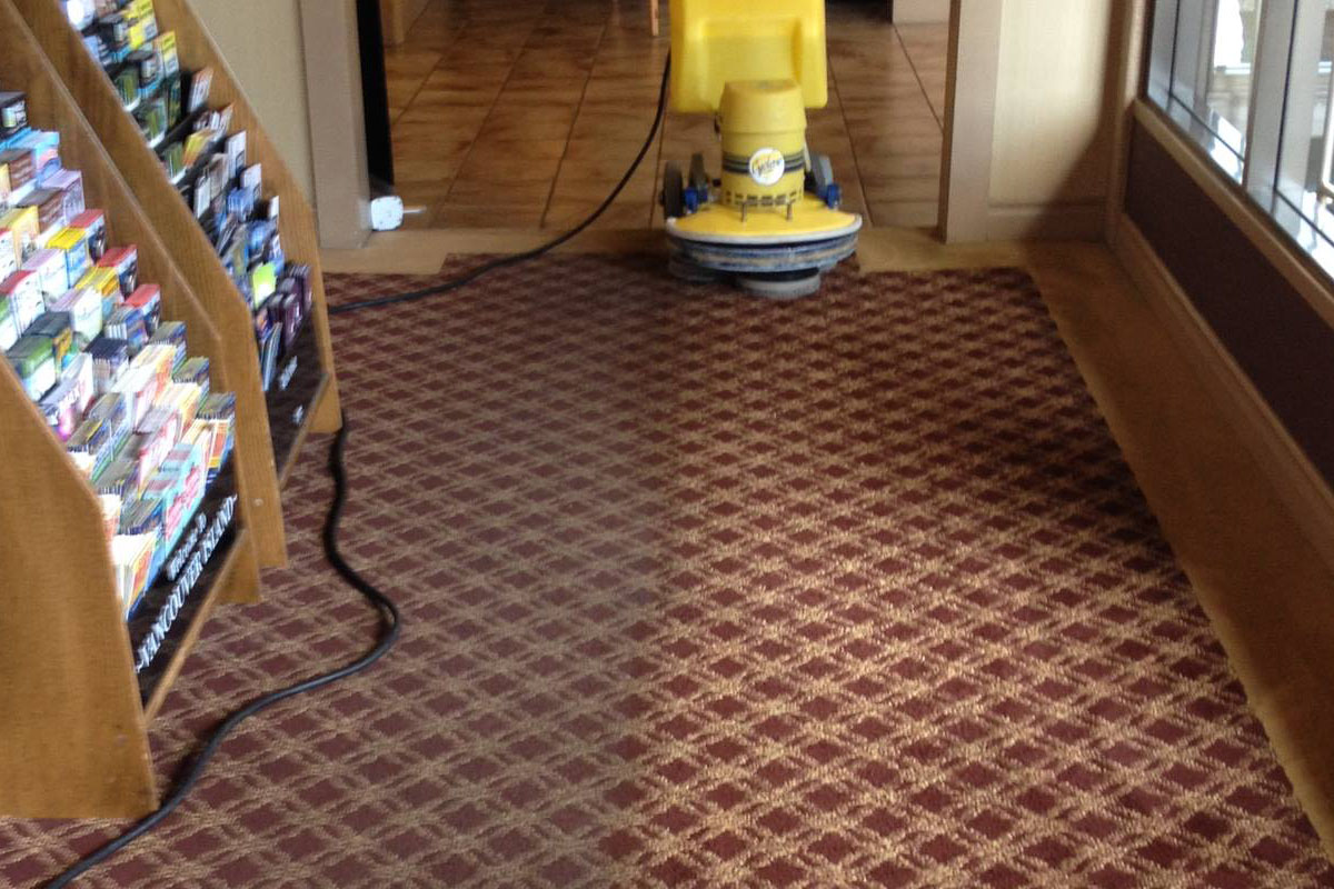 High-traffic office hallway with carpets restored to a clean and fresh state.