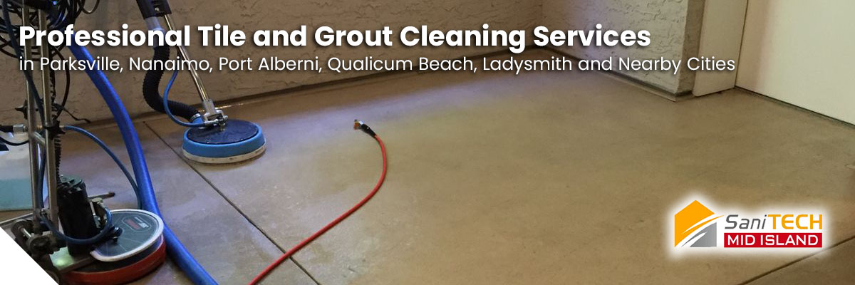 SaniTECH technician using specialized tools for spotless tile and grout cleaning.